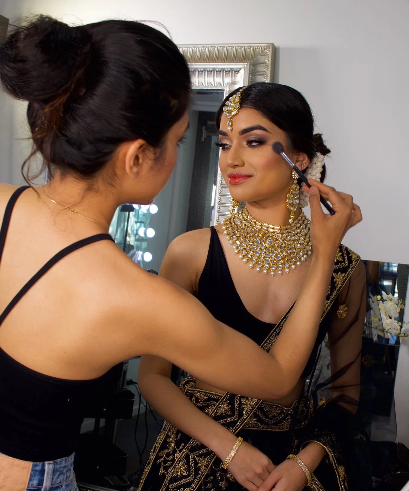 Heera refining a bride’s makeup during her bridal preparation