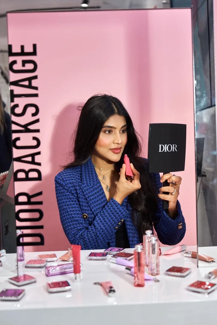 Heera exploring a lip product at a Dior Backstage product launch