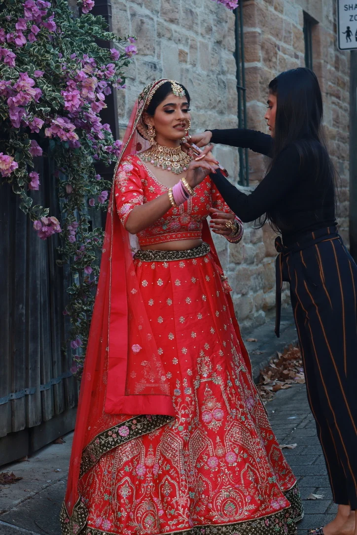 Heera refining jewellery and the complete red bridal look outdoors