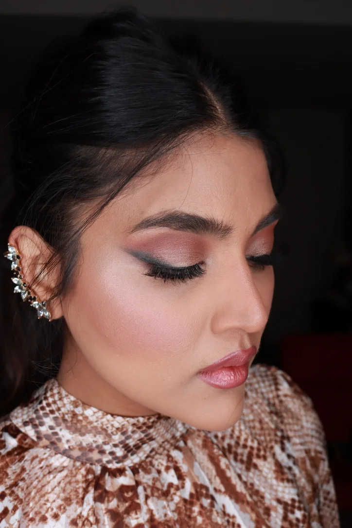 Heera exploring a softly defined eye and luminous makeup finish on herself