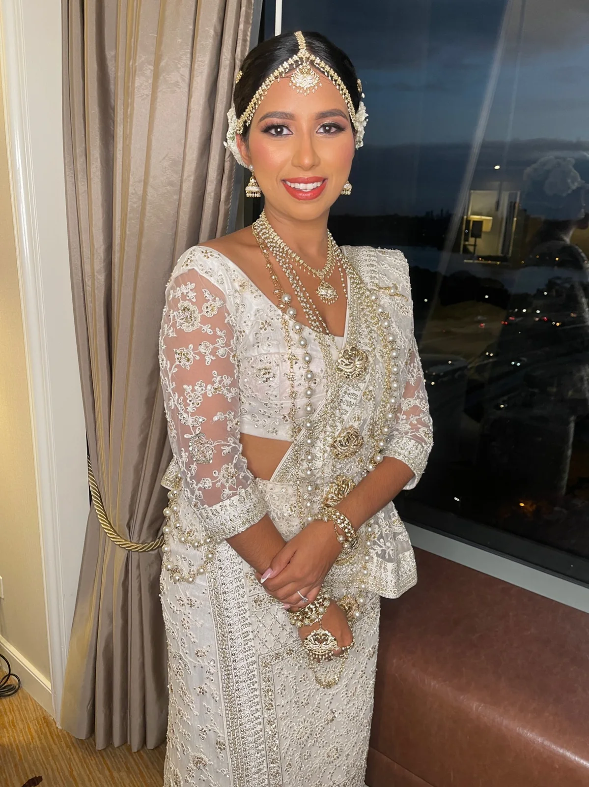 An embellished ivory outfit, silver jewellery and softly styled hair
