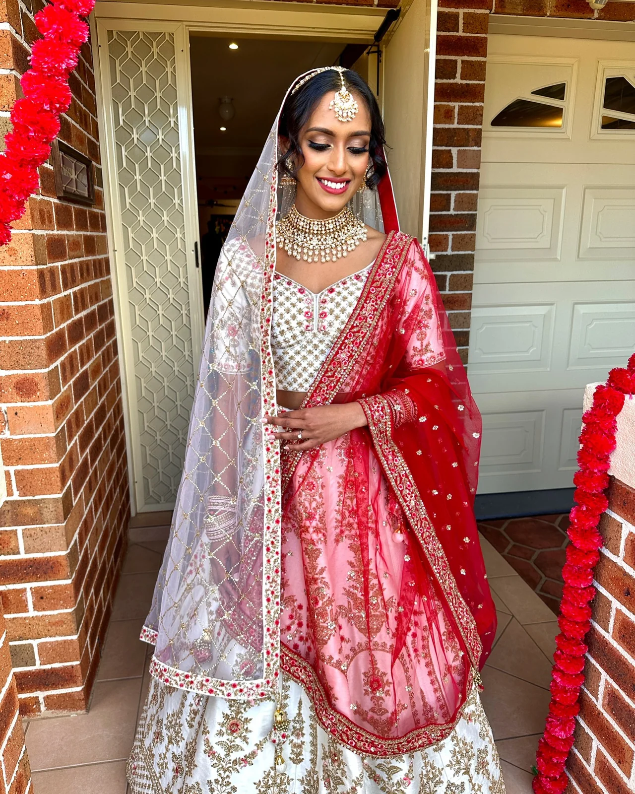 The full red and silver outfit, bridal dupatta and coordinated jewellery