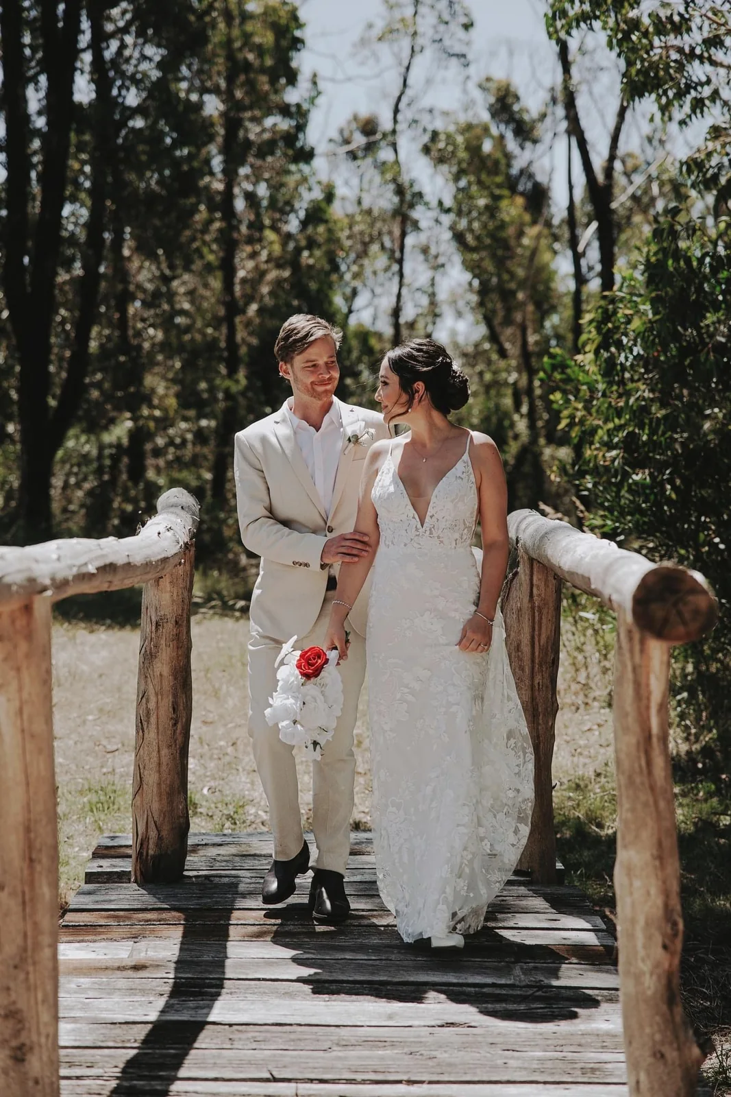 A white gown, soft bridal hair and a couple’s wedding portrait
